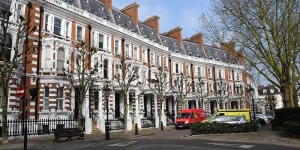 Row of historic London townhouses with traditional timber sash windows