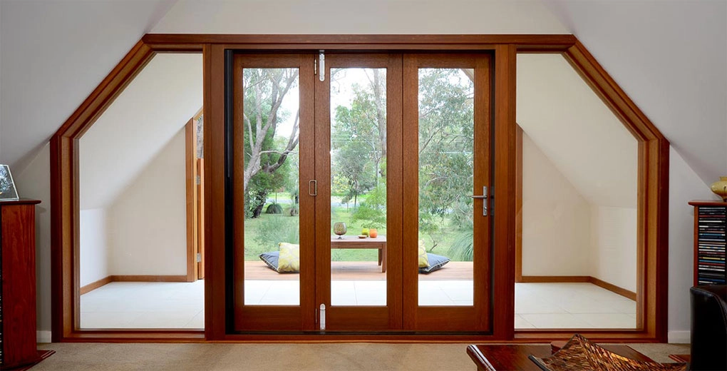 Bespoke timber bifold doors fitted within an angled garden opening
