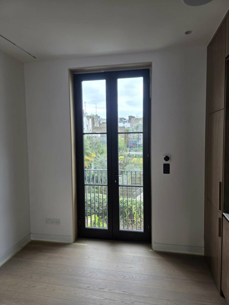 Completed black timber French door in the Notting Hill listed property