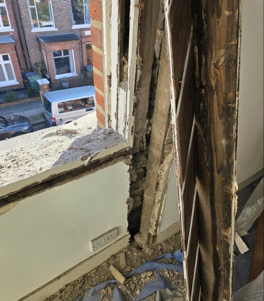 Exposed timber window opening during inspection and replacement work