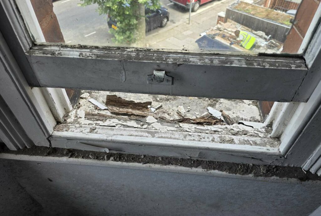 Extensive decay exposed beneath a timber sash window