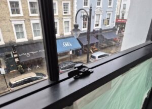 Black timber sash window with narrow sight lines in the Notting Hill project
