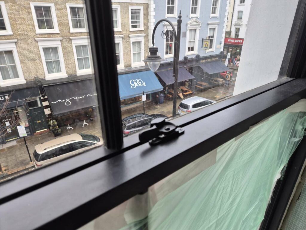 Black timber sash window with FINEO vacuum glazing and narrow sightlines