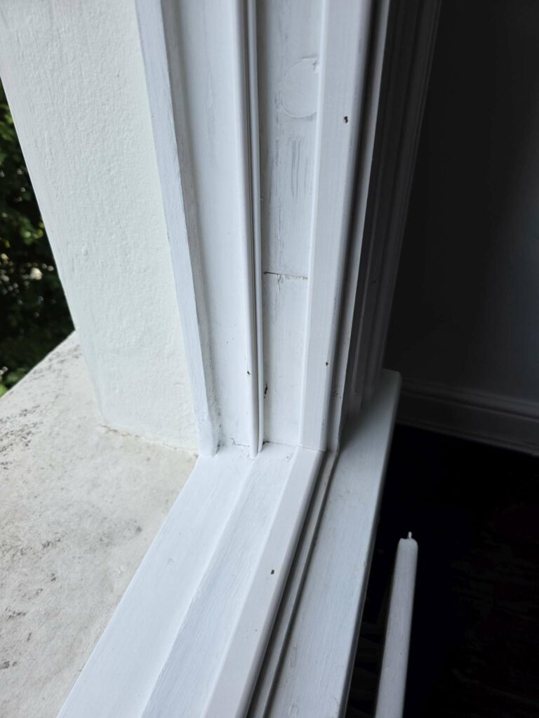 Repaired and finished timber sash window frame detail