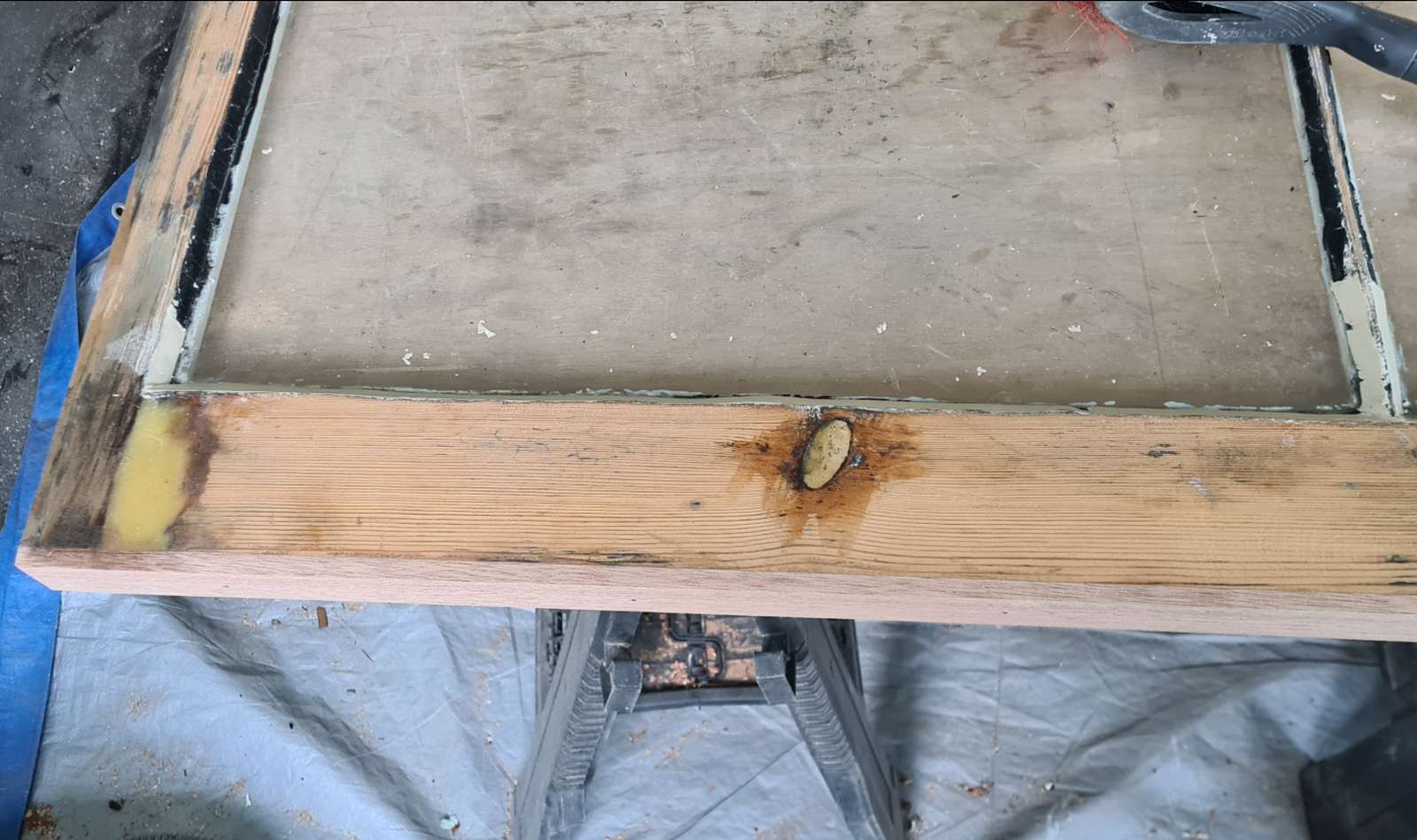 Timber sash window with a repaired bottom rail during restoration