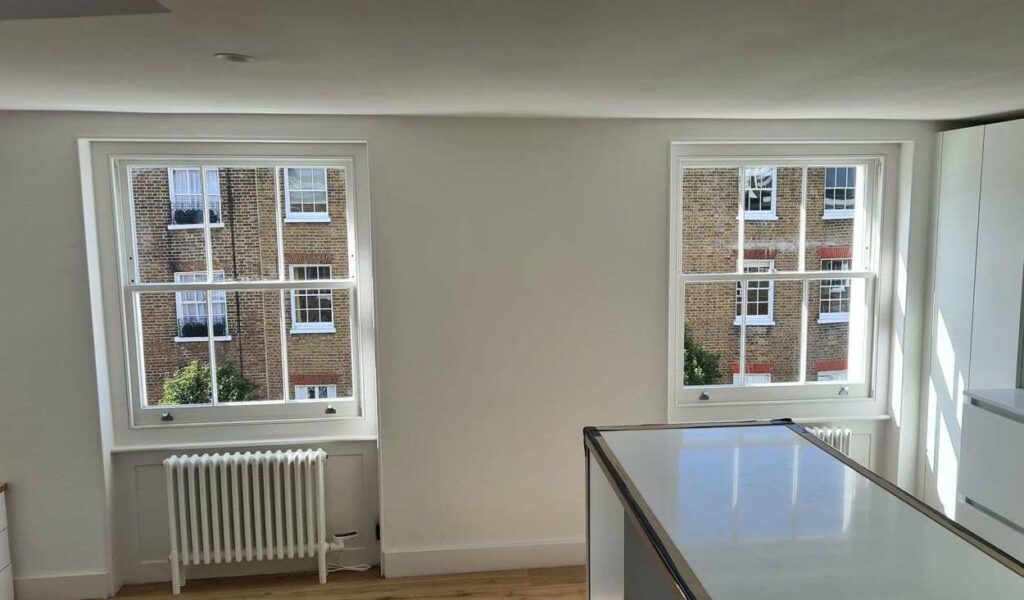 New single-glazed timber sash windows installed in a listed building