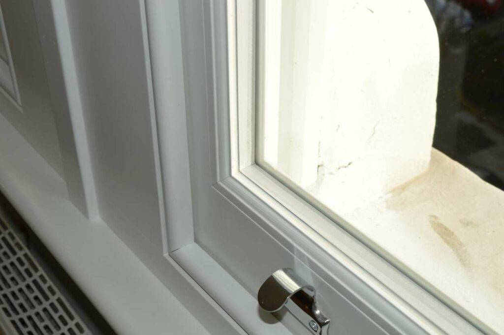 Close-up of glazing fitted into a white timber sash window