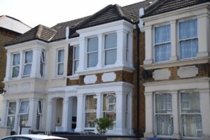 Victorian terraced houses in London with traditional and replacement window styles