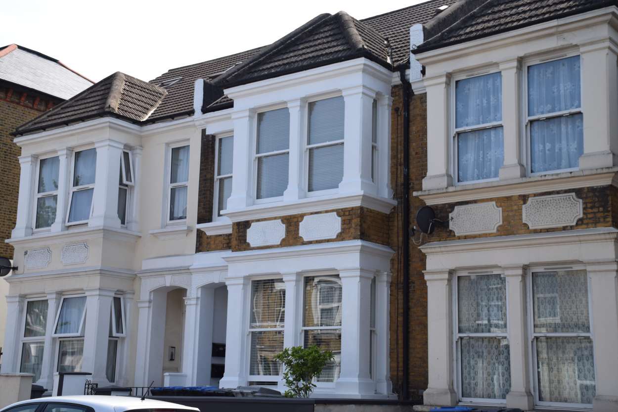 Victorian terraced houses in London with traditional and replacement window styles