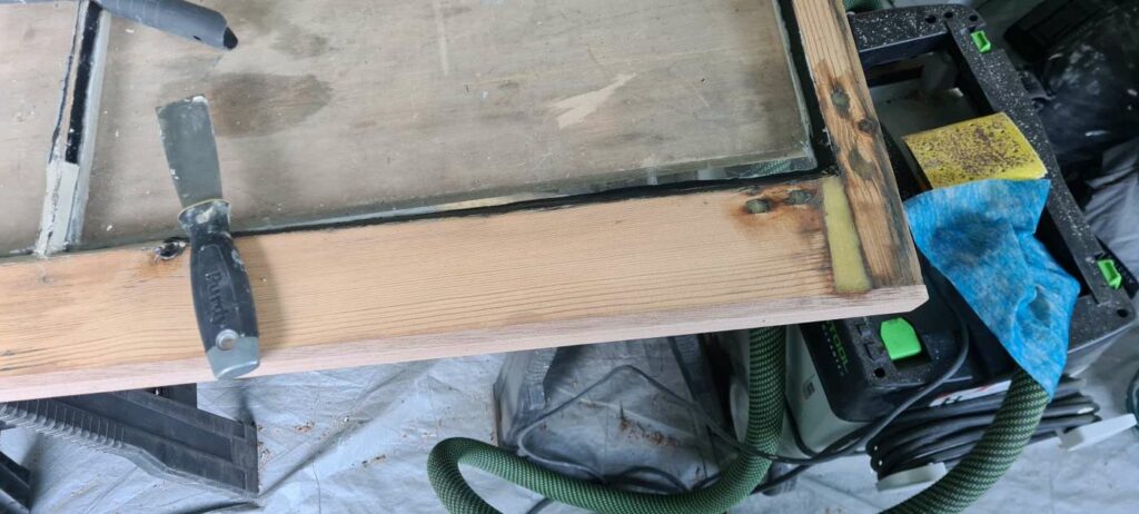 Localised timber repair to the lower section of a sash window during restoration