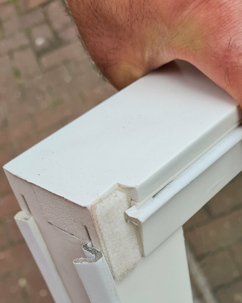 Draught-proofing seals fitted to a timber sash during renovation