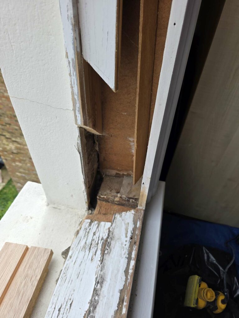 Lower sash window frame section after decayed timber was removed
