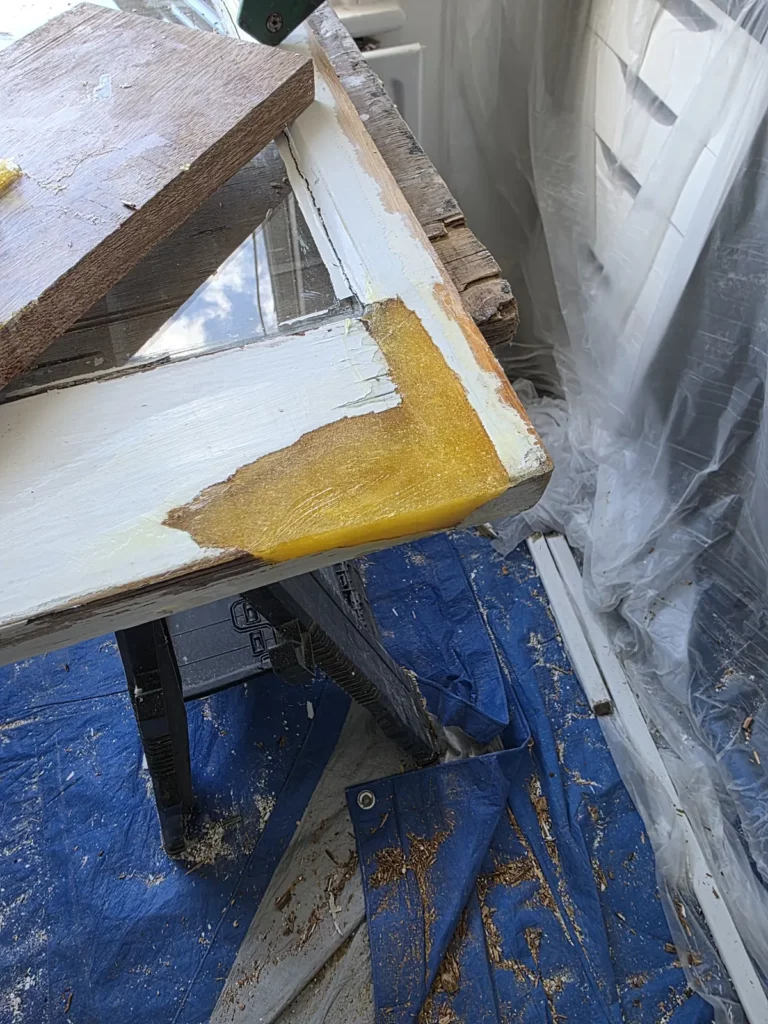 Removed timber sash undergoing preparation and local repair