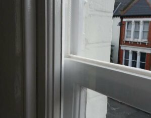 Open sash window with a visible sash cord