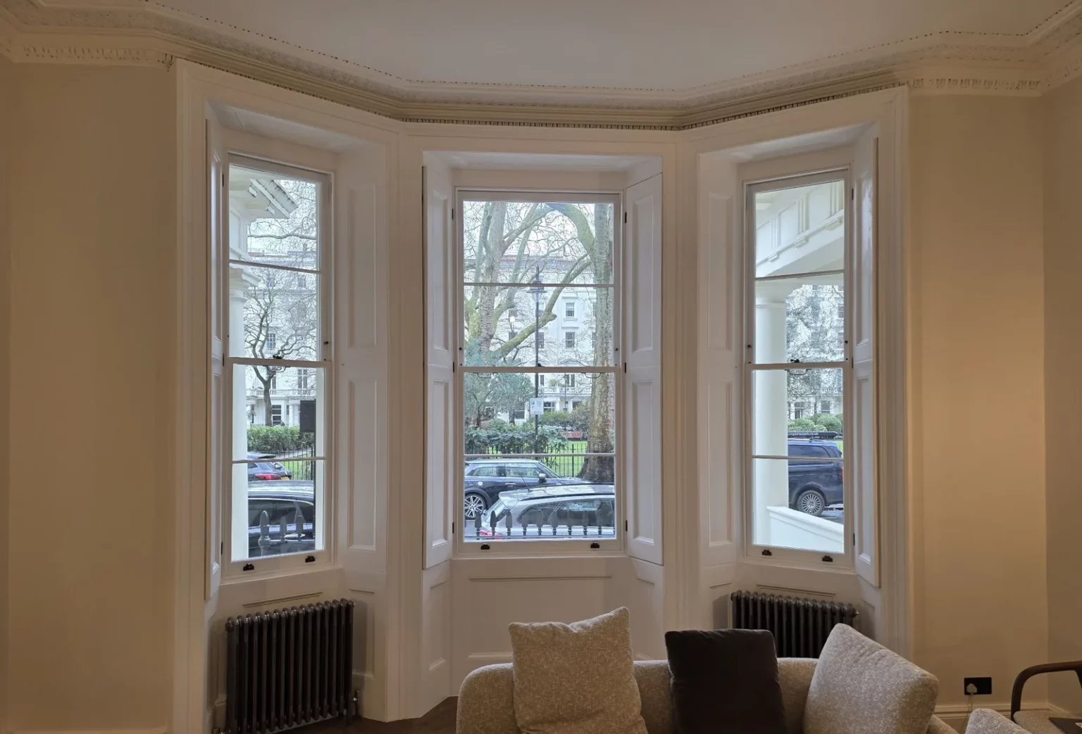 New sashes in a bay window with the existing internal shutters retained