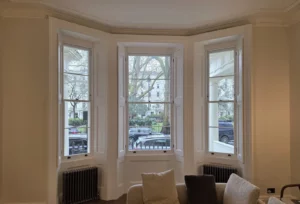 New sashes in a bay window with the existing internal shutters retained